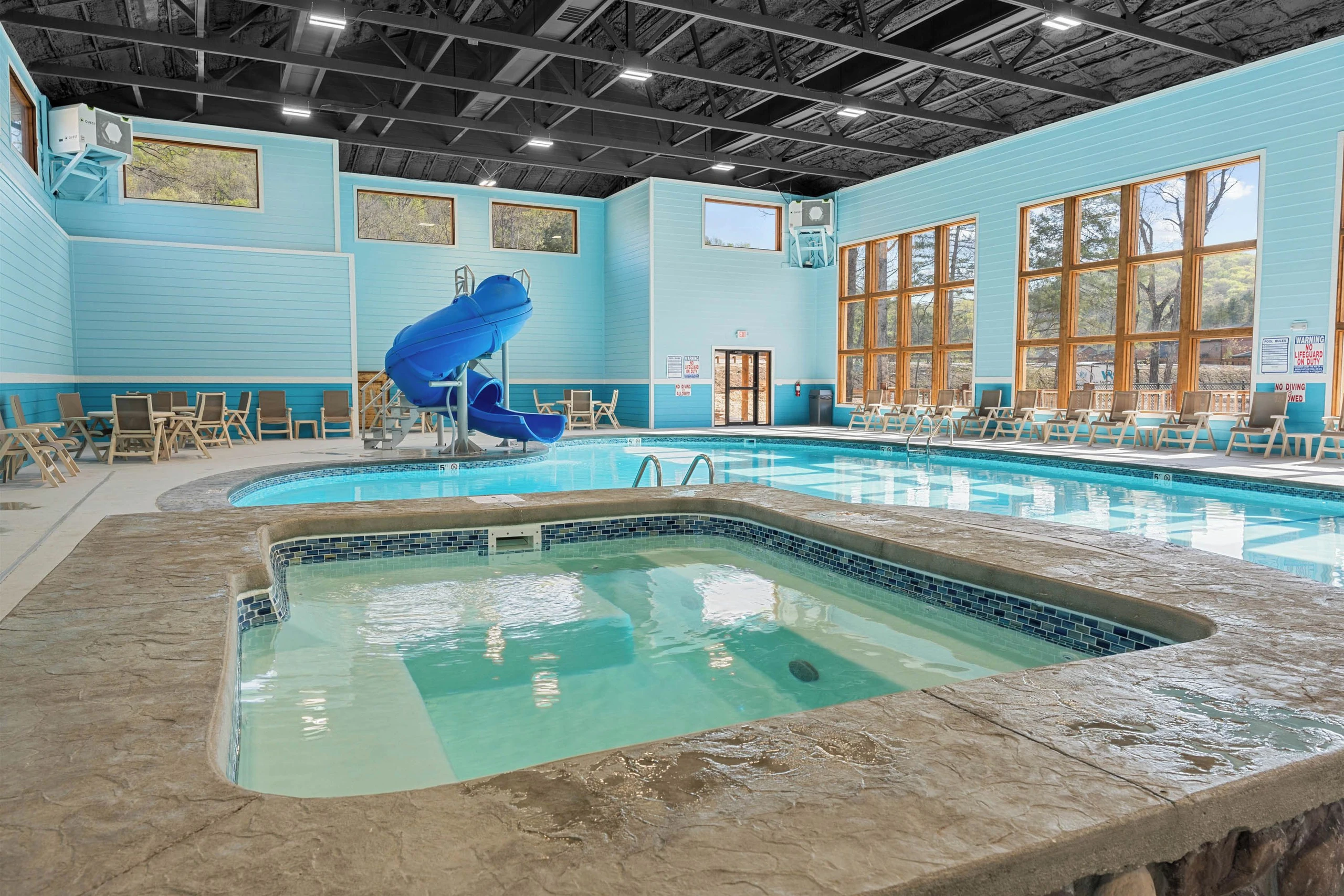 Indoor pool with ample natural light. Walking distance from your cabin. Hot tub and indoor tube slide.