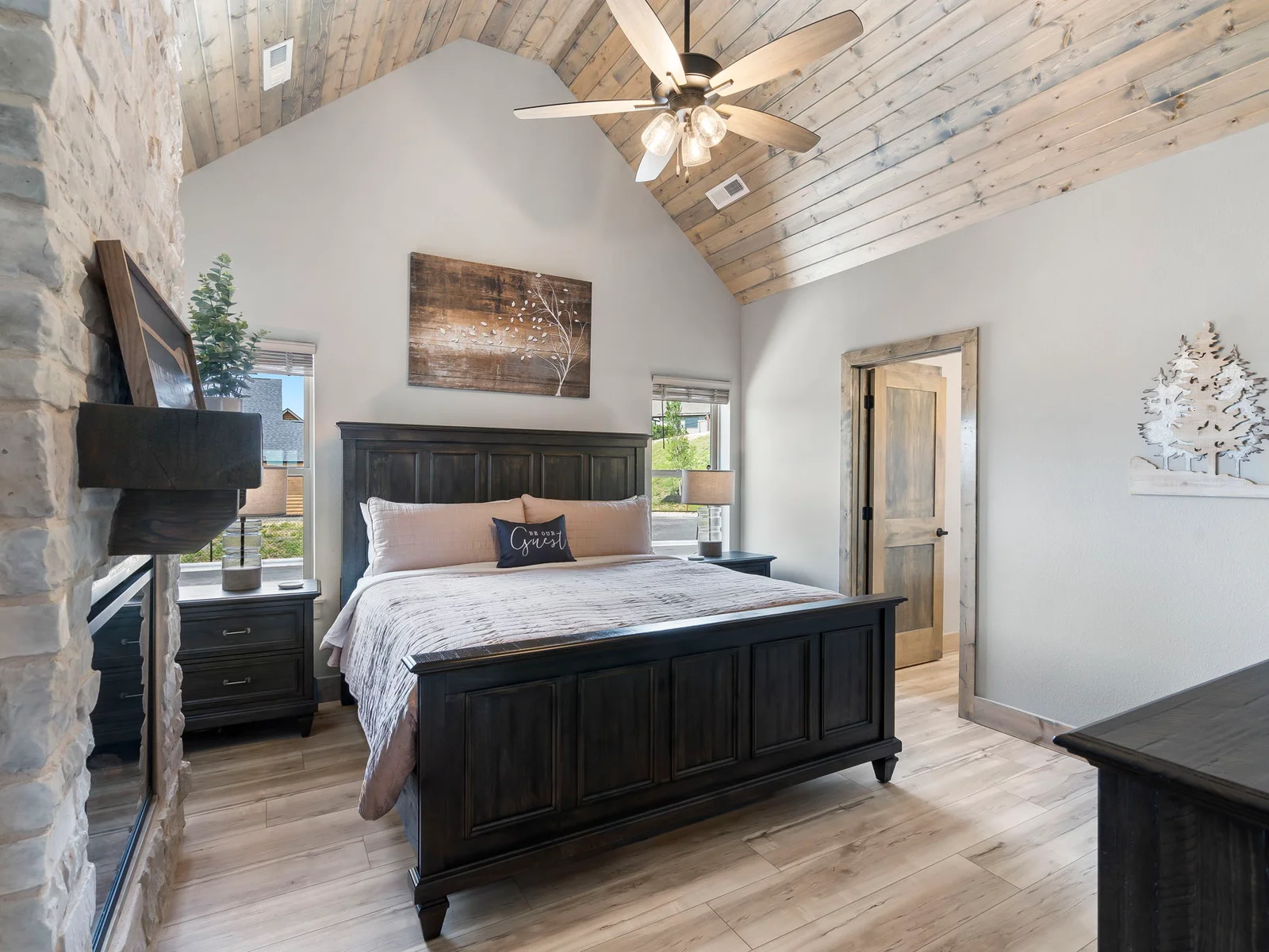 King bedroom with en suite bathroom and electric fireplace