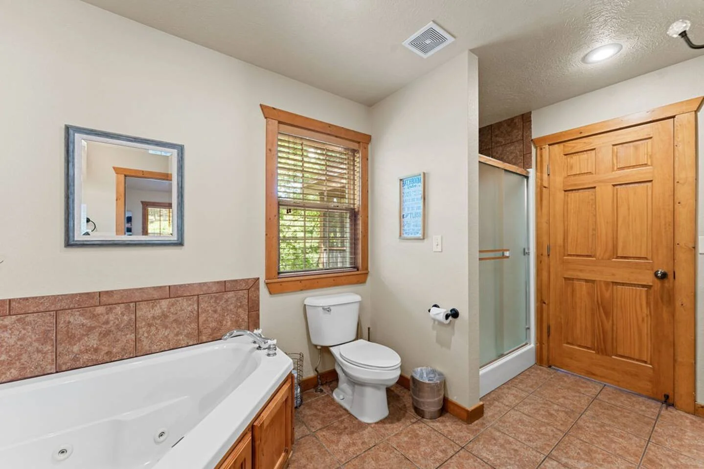 2nd master bath with jacuzzi tub and its own standalone shower unit