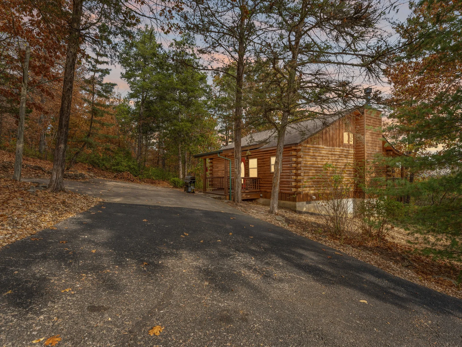 Tucked in the trees, glowing with charm — your cozy cabin hideaway awaits