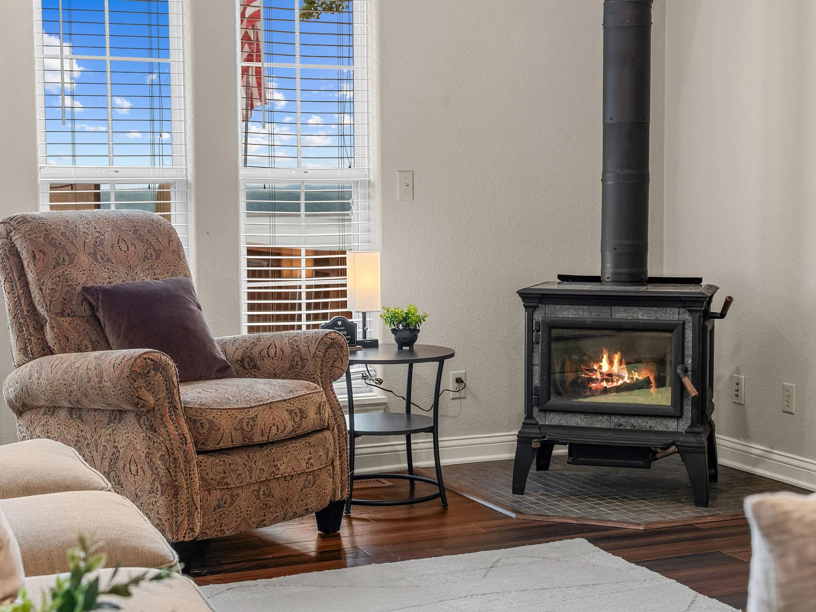 The leather armchair next to the wood stove, a good book within arm's reach, the lake glinting through the window across the room. This spot gets claimed early.
