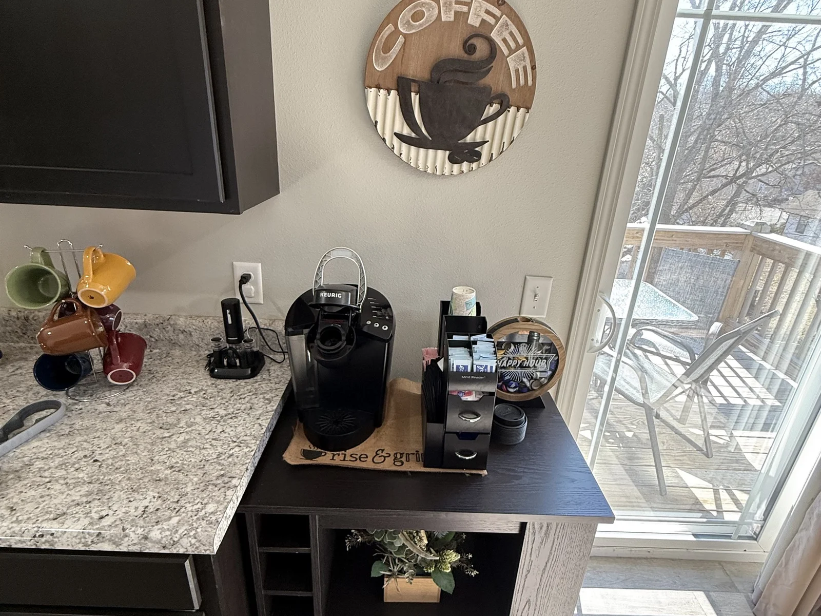 K cup coffee maker and standard coffee maker on counter for your convenience. A starter amount of bottled water, k cups, sugar and creamers are provided.