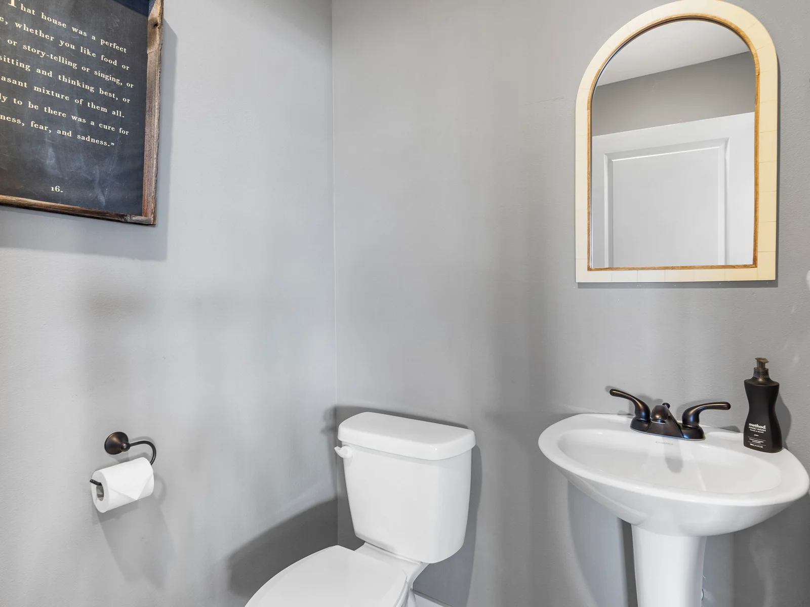 1/2 bathroom with washer and dryer located near living room