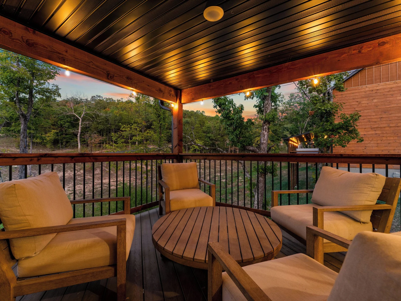 Deck with strings of lights give soft glow at night.