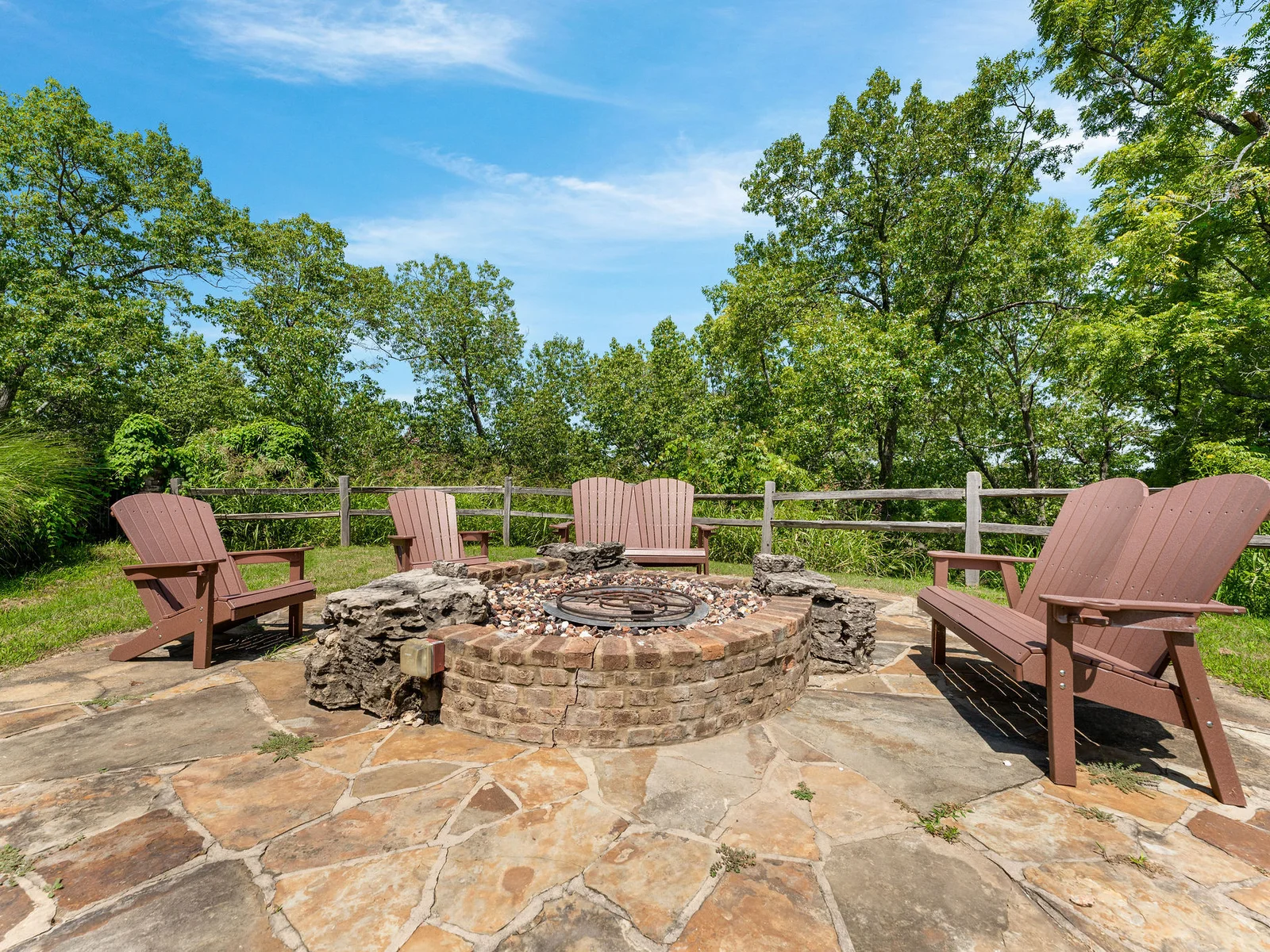 Gather 'round the stunning stone fire pit for unforgettable evenings under the stars!
