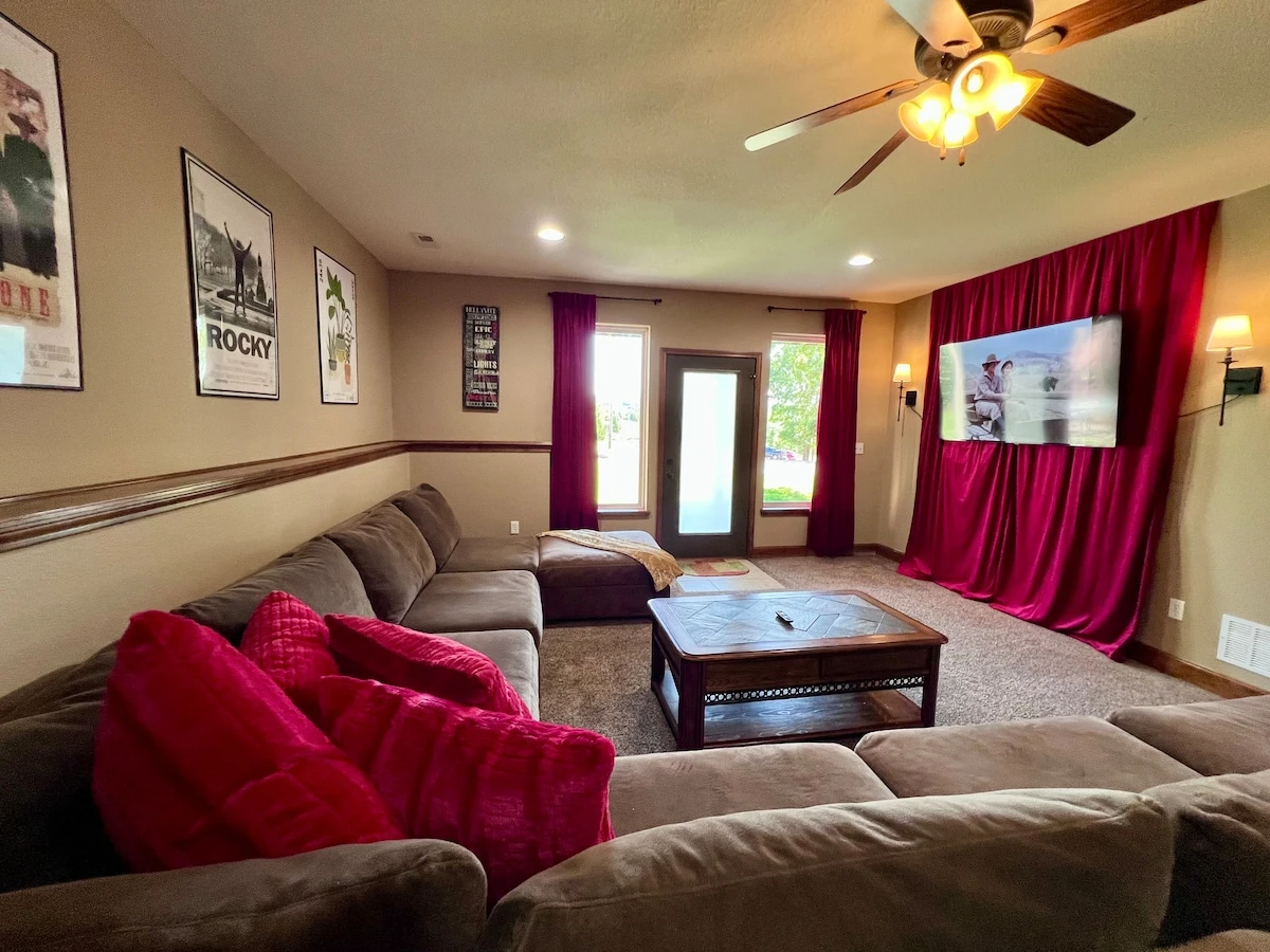 Movie room with large sectional sofa--65" smart tv